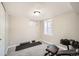 Home gym boasts carpeted floors, weights, workout equipment, and bright windows, creating a dedicated fitness space at 1640 Harrison St, Denver, CO 80206