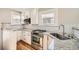 Modern kitchen featuring stainless steel appliances and granite countertops at 1640 Harrison St, Denver, CO 80206