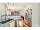 Bright kitchen with granite counters, subway tile, and stainless steel appliances at 1640 Harrison St, Denver, CO 80206