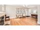 Open living room with hardwood floors, fireplace, and lots of light at 1640 Harrison St, Denver, CO 80206