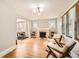 Bright living room featuring hardwood floors, fireplace, and large windows at 1640 Harrison St, Denver, CO 80206