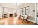 Spacious living room with hardwood floors, fireplace, and natural light at 1640 Harrison St, Denver, CO 80206