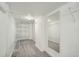 Walk-in closet boasts ample shelving and a mirror, providing an organized storage solution for clothing and accessories at 1640 Harrison St, Denver, CO 80206