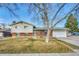 Charming single-Gathering home with a brick facade and attached garage at 12605 E Exposition Ave, Aurora, CO 80012