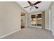 Bright living room with sliding glass door and access to adjacent kitchen area at 12605 E Exposition Ave, Aurora, CO 80012