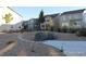 Landscaped neighborhood area with native stone, rock ground cover, and sidewalks at 15305 W 93Rd Ave, Arvada, CO 80007