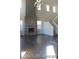 Open floor plan living room boasts soaring ceilings, fireplace, and open space at 15305 W 93Rd Ave, Arvada, CO 80007