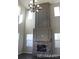 Living room with soaring ceilings, a stone fireplace, and hardwood floors at 15305 W 93Rd Ave, Arvada, CO 80007