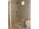 Glass shower featuring modern fixtures and finishes, enhancing the bathroom's contemporary aesthetic at 15305 W 93Rd Ave, Arvada, CO 80007