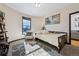 Cozy bedroom with a daybed, decorative rug, and a bright window at 6985 Fallon Cir, Castle Rock, CO 80104