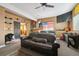 Comfortable bedroom with a couch, shelves and an American flag on the wall at 6985 Fallon Cir, Castle Rock, CO 80104