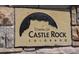 Close up of a sign that says Town Of Castle Rock Colorado on a stone wall at 6985 Fallon Cir, Castle Rock, CO 80104