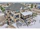 Spacious two-story home features a large deck, stone accents, and a well-manicured yard in a suburban neighborhood at 6985 Fallon Cir, Castle Rock, CO 80104