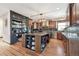 Spacious kitchen featuring custom cabinets, an island, and modern appliances at 6985 Fallon Cir, Castle Rock, CO 80104