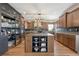 Modern kitchen with custom cabinets, a central island, and stainless steel appliances offers plenty of counter space at 6985 Fallon Cir, Castle Rock, CO 80104