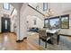 Bright living room features archways, hardwood floors, and large windows with great natural lighting at 6985 Fallon Cir, Castle Rock, CO 80104