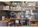 Walk-in pantry features custom shelves, ample storage for kitchen appliances, and clear containers for food storage at 6985 Fallon Cir, Castle Rock, CO 80104