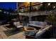 Cozy outdoor patio with a fire pit and comfortable seating for evening gatherings at 6985 Fallon Cir, Castle Rock, CO 80104