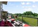 Outdoor balcony with grill and comfortable seating overlooking a golf course at 10243 Spring Green Dr, Englewood, CO 80112