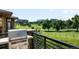 Balcony view overlooking a lush green golf course with surrounding office buildings at 10243 Spring Green Dr, Englewood, CO 80112
