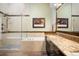 Luxury bathroom featuring a soaking tub, walk-in shower, granite countertops, and stylish fixtures at 10243 Spring Green Dr, Englewood, CO 80112