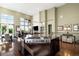 Open concept kitchen with large island, stone countertops, and high ceilings at 10243 Spring Green Dr, Englewood, CO 80112