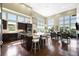 Open-concept kitchen and living area with a large island and hardwood floors at 10243 Spring Green Dr, Englewood, CO 80112