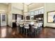 Open kitchen featuring dark cabinets, an island with seating, and stainless steel appliances at 10243 Spring Green Dr, Englewood, CO 80112