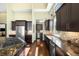 Gourmet kitchen featuring stainless steel appliances and granite countertops at 10243 Spring Green Dr, Englewood, CO 80112
