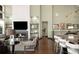 Living room boasts fireplace, large windows, and a comfortable seating arrangement at 10243 Spring Green Dr, Englewood, CO 80112