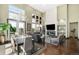 Bright living room with a fireplace, large windows, and an open floor plan at 10243 Spring Green Dr, Englewood, CO 80112