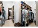 Spacious walk-in closet with custom shelving and ample storage for clothes and accessories at 10243 Spring Green Dr, Englewood, CO 80112
