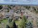 Beautiful aerial view of the property surrounded by mature trees in a lovely neighborhood at 6719 E Costilla Cir, Centennial, CO 80112