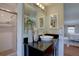 Bathroom features include a shower and a vanity with a black countertop and vessel sink at 6719 E Costilla Cir, Centennial, CO 80112