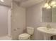Cozy bathroom complete with shower, toilet, and pedestal sink at 6719 E Costilla Cir, Centennial, CO 80112