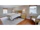 Serene bedroom with hardwood floors, natural light, and neutral paint, creating a relaxing atmosphere at 6719 E Costilla Cir, Centennial, CO 80112