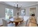 Bright dining room with gray walls, hardwood floors and large window at 6719 E Costilla Cir, Centennial, CO 80112