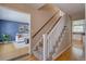 Entryway with hardwood floors and carpeted stairs leading to the upper level at 6719 E Costilla Cir, Centennial, CO 80112