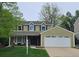Charming two-story home with a well-manicured lawn and attached two car garage at 6719 E Costilla Cir, Centennial, CO 80112