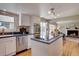 Kitchen featuring white cabinets, stainless steel appliances and center island at 6719 E Costilla Cir, Centennial, CO 80112