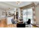 Open kitchen and dining area with access to backyard; updated with stainless appliances and white cabinets at 6719 E Costilla Cir, Centennial, CO 80112