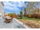 Beautiful backyard offers a spacious patio for dining and a well-maintained lawn for outdoor enjoyment at 4808 S Ward Way, Morrison, CO 80465