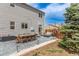 Enjoy outdoor living on the patio with seating and dining areas, perfect for entertaining or relaxing at 4808 S Ward Way, Morrison, CO 80465