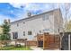 Backyard with lush trees and a patio, creating a private and serene outdoor oasis at 4808 S Ward Way, Morrison, CO 80465