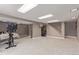 The carpeted basement has stairs and open space for storage at 4808 S Ward Way, Morrison, CO 80465