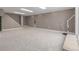 Neutral basement with carpet, light-colored paint, and stairs leading to the upper level at 4808 S Ward Way, Morrison, CO 80465