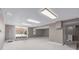 Finished basement featuring carpeted floors, sliding glass doors to a patio and fluorescent lighting at 4808 S Ward Way, Morrison, CO 80465