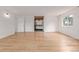 Spacious bedroom featuring light hardwood floors, natural light and an ensuite bathroom at 4808 S Ward Way, Morrison, CO 80465
