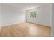 Bedroom featuring light hardwood floors and a large window letting in plenty of natural light at 4808 S Ward Way, Morrison, CO 80465