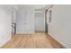 Bedroom with wood-look floors and walk-in closet; next to the stairs at 4808 S Ward Way, Morrison, CO 80465